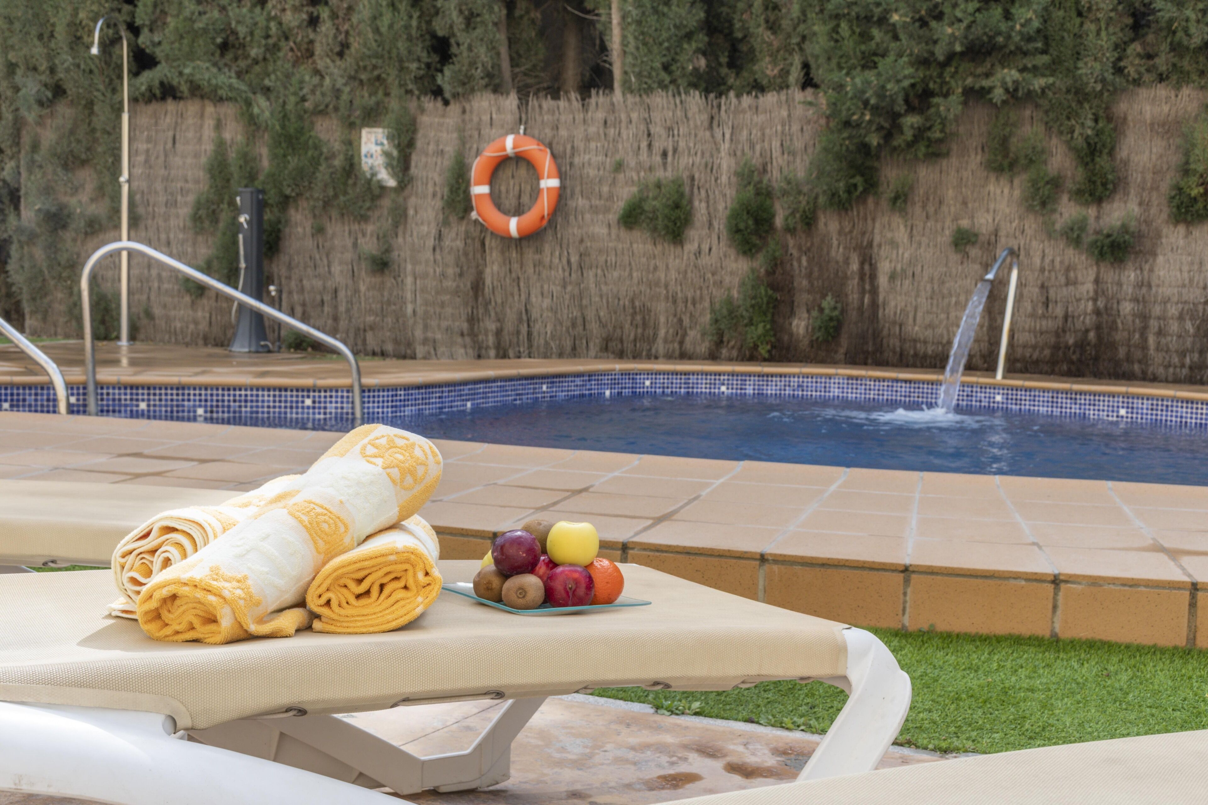 outdoor pool, open 10:00 am to 9:00 pm, pool umbrellas, pool loungers