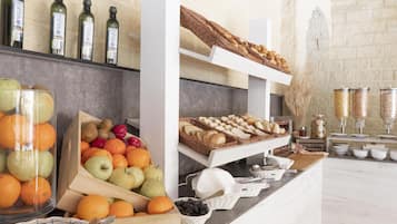 A buffet area with various food items and beverages.