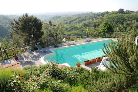 Seasonal outdoor pool, open 7:30 AM to 8:00 PM, pool umbrellas