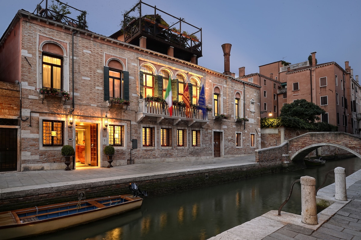 luxury hotel room in naples with big windows looking out onto bay of naples