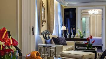 A well-lit living room with a sofa, a coffee table, and a decorative vase.
