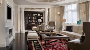 A spacious living room with a fireplace, a large chandelier, and a comfortable seating area. - Sofitel Legend People's Grand Hotel Xian (Xi'an)