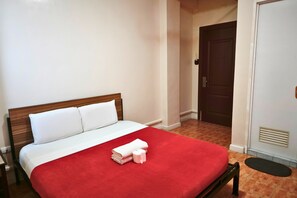 A hotel room with a bed, a wardrobe, and a door. - My Hotel Davao City (Davao)