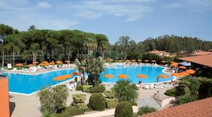 Outdoor pool, open 8 AM to 7 PM, pool umbrellas, pool loungers