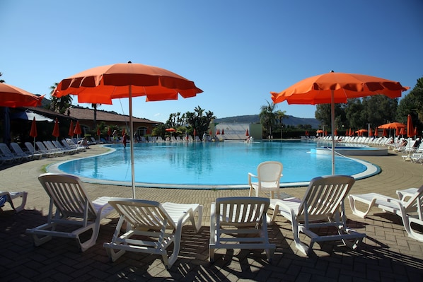 Outdoor pool, open 8 AM to 7 PM, pool umbrellas, pool loungers