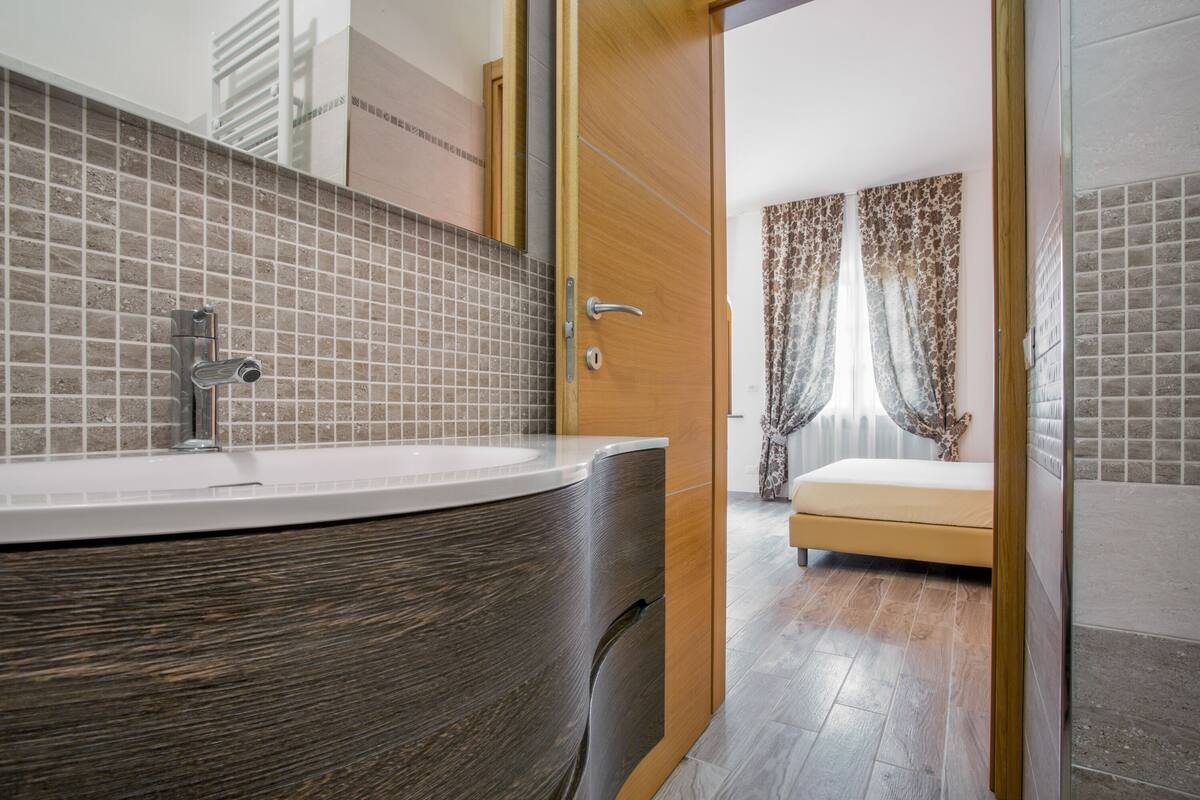 superior quadruple room | bathroom | shower, free toiletries, hair dryer, bidet