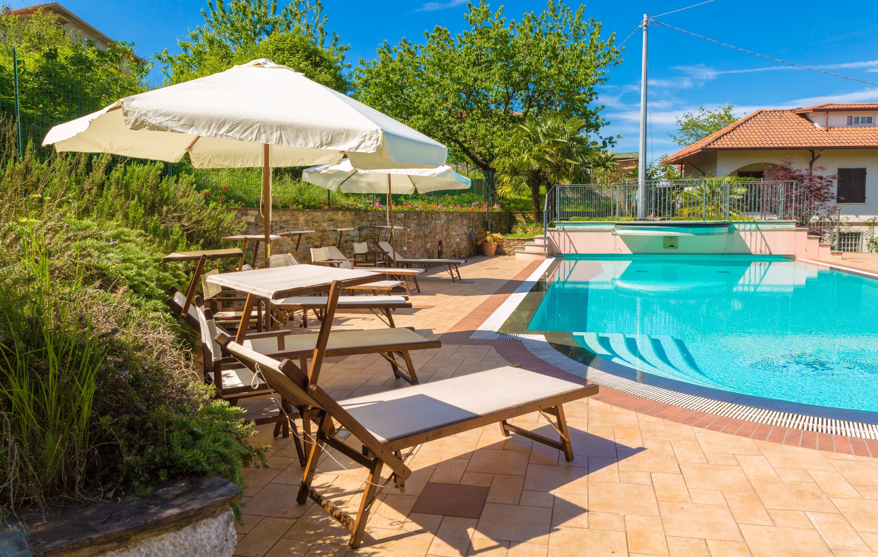 outdoor pool, pool umbrellas, pool loungers