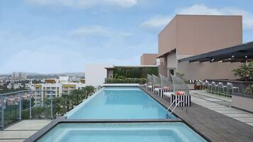 Outdoor pool, open 6:00 AM to 8:00 PM, free cabanas, pool umbrellas