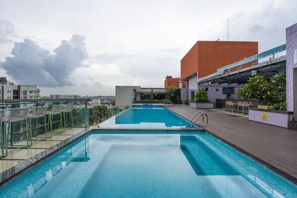 Outdoor pool, open 6:00 AM to 8:00 PM, free cabanas, pool umbrellas