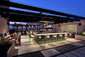 Rooftop bar, pool views, open daily