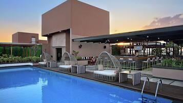 Outdoor pool, open 6:00 AM to 8:00 PM, free pool cabanas, pool umbrellas