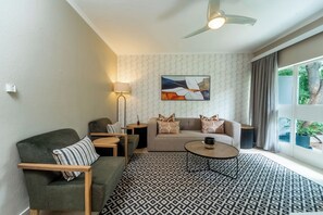 Suite, 1 Double Bed | Living area | 32-inch LED TV with satellite channels, TV - Cresta Sprayview (Victoria Falls)