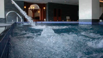 Indoor pool, open 9 AM to 4 PM, pool umbrellas, pool loungers