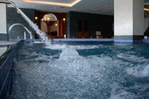 Indoor pool, open 9 AM to 4 PM, pool umbrellas, pool loungers