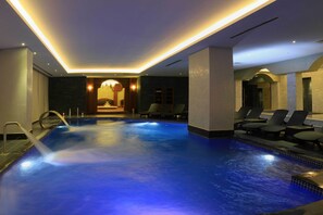 Indoor pool, open 9 AM to 4 PM, pool umbrellas, sun loungers