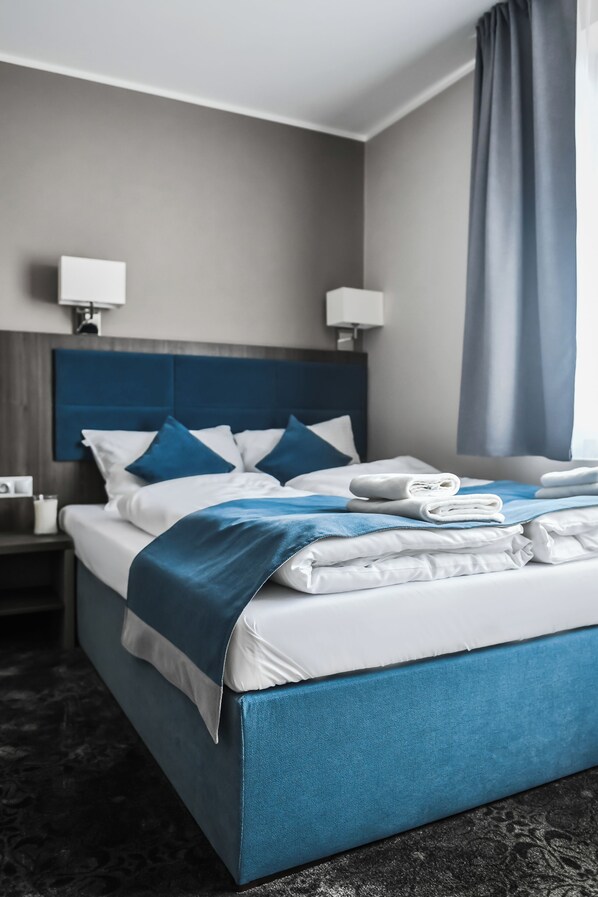 Hypo-allergenic bedding, desk, blackout curtains, iron/ironing board