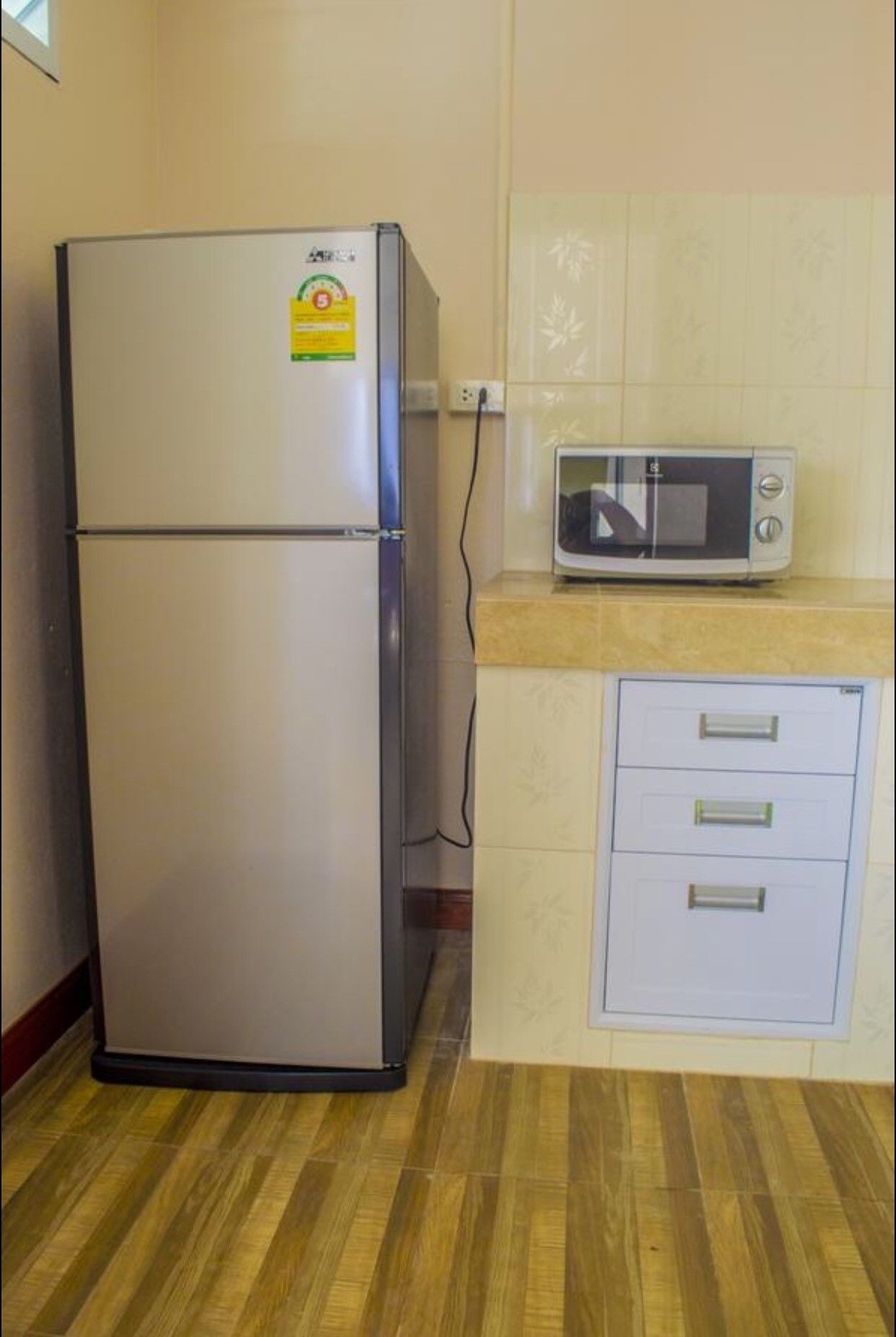 fridge, microwave, electric kettle, cookware/dishes/utensils