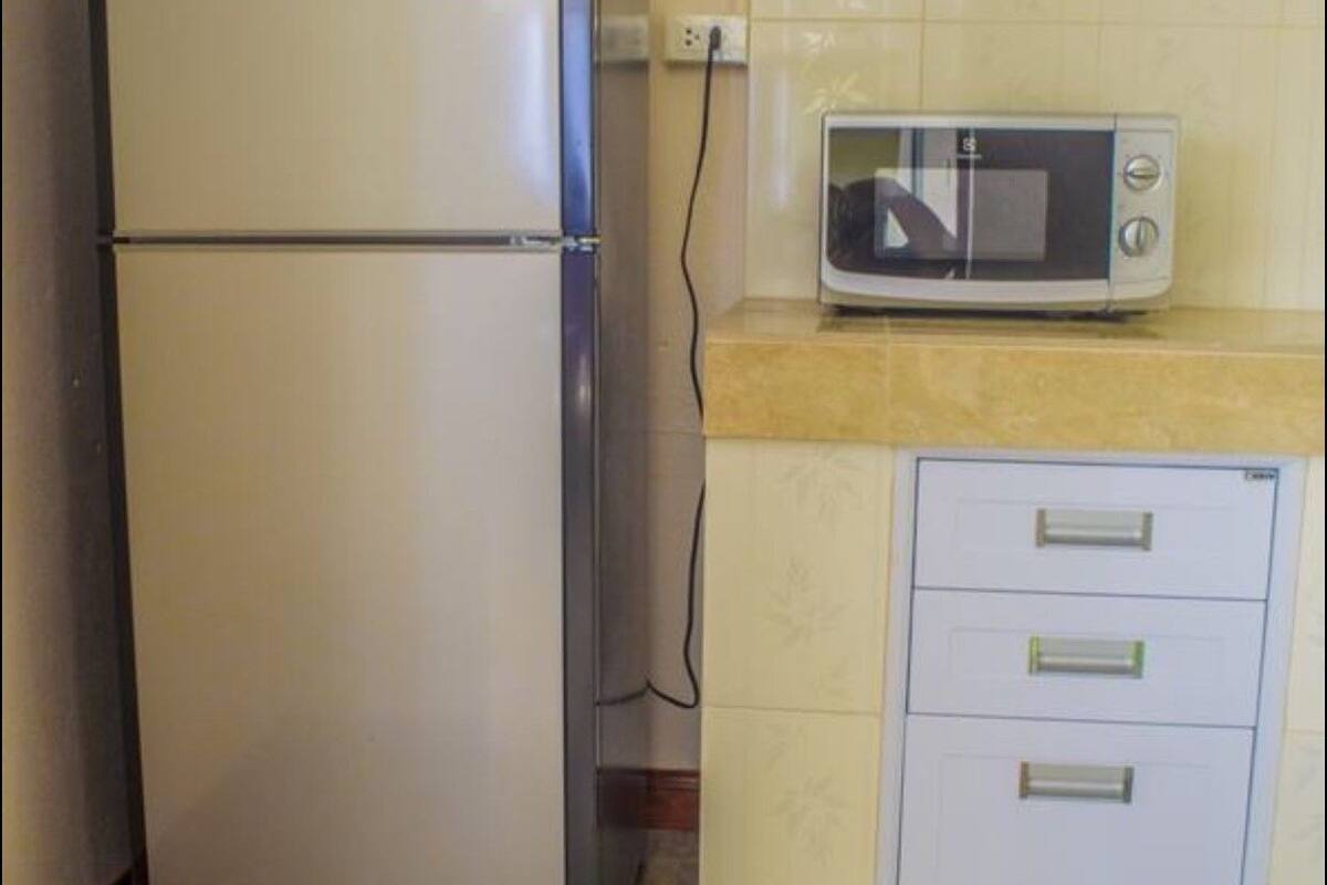 fridge, microwave, electric kettle, cookware/dishes/utensils