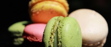 A close-up of three macarons in different colors.