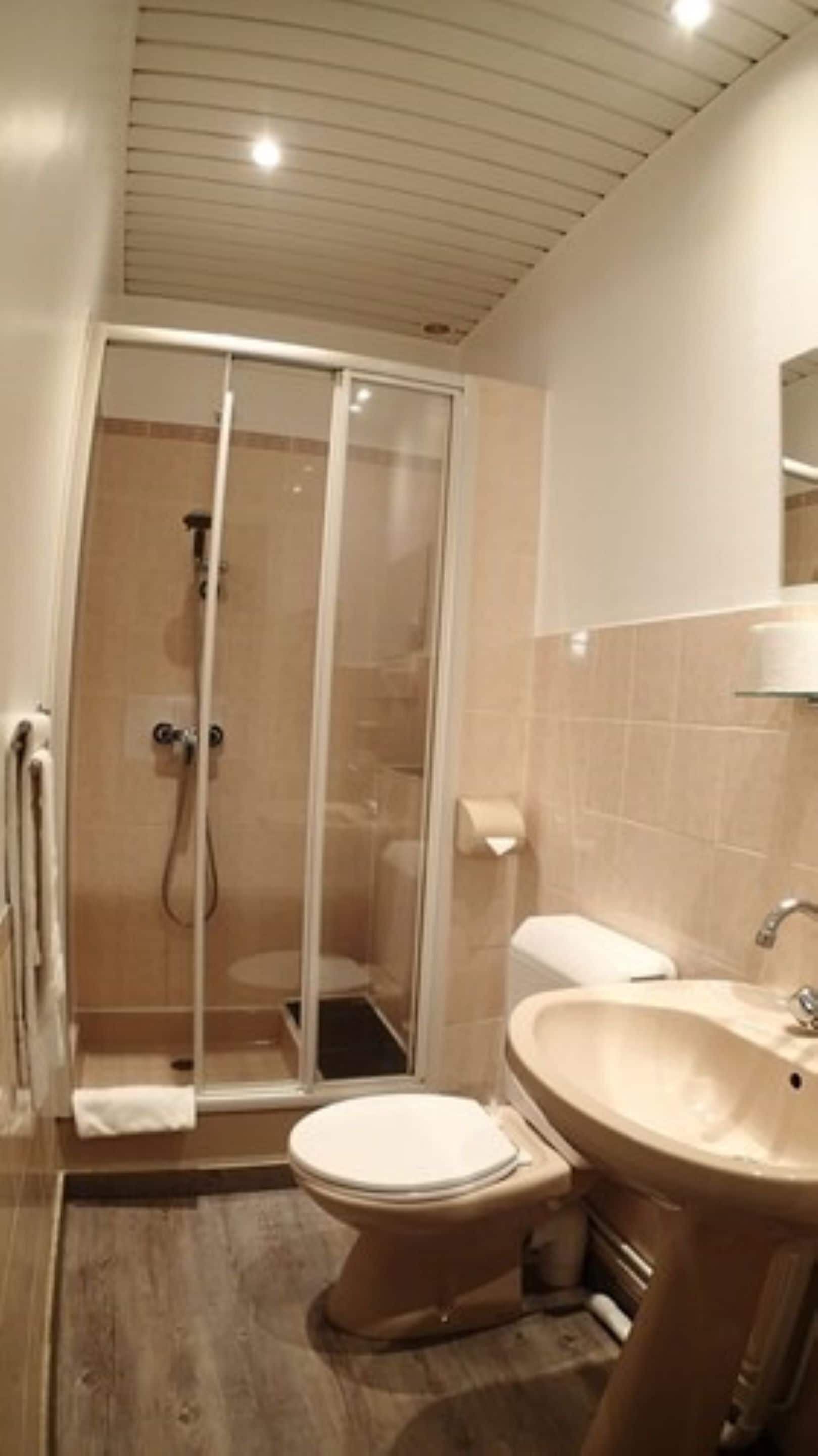 standard double room | bathroom | eco-friendly toiletries, hair dryer, towels