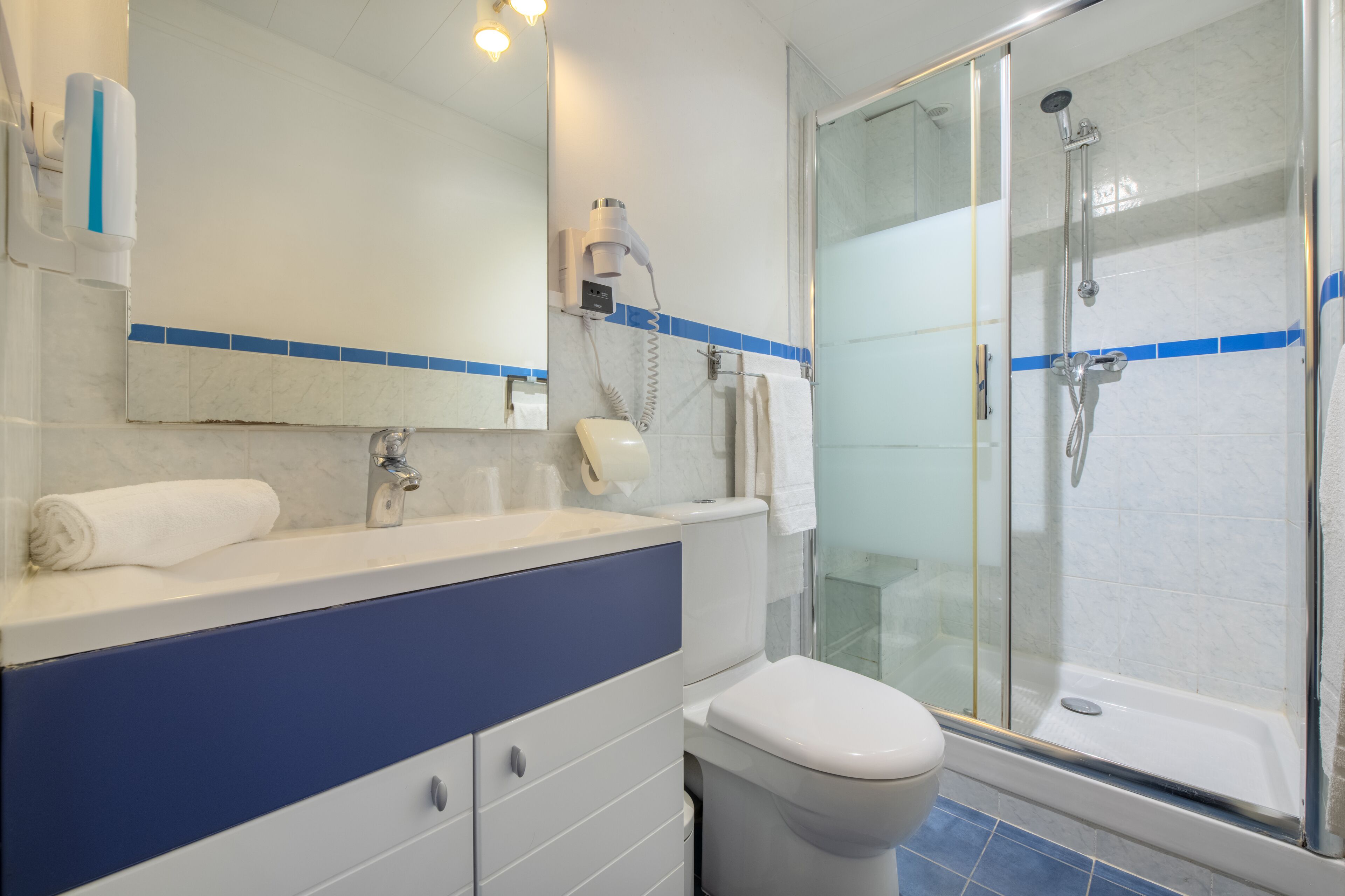 eco-friendly toiletries, hair dryer, towels