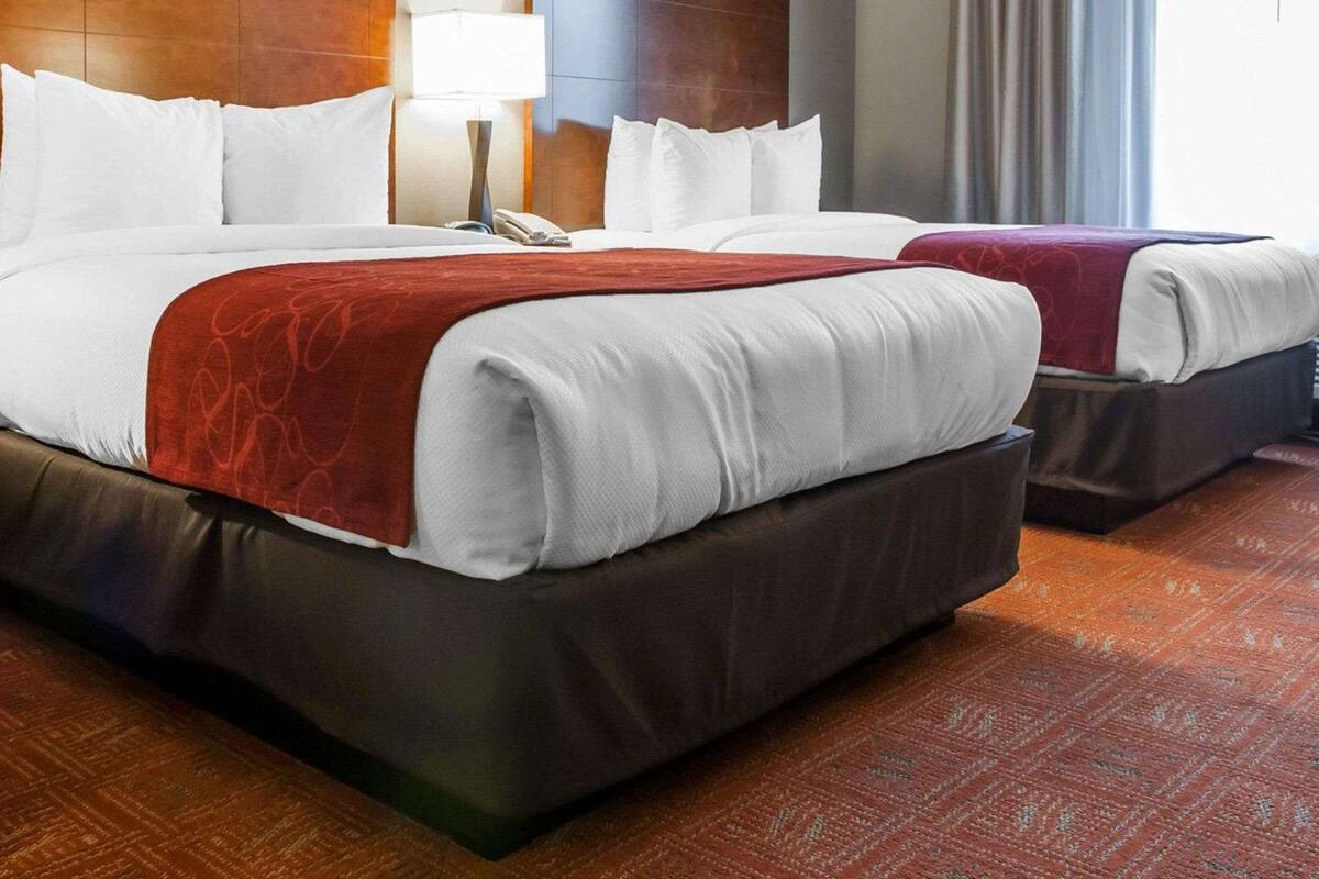 premium bedding, pillow-top beds, desk, laptop workspace