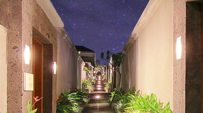 A narrow corridor with a starry sky ceiling, leading to a staircase. - The Widyas Bali Villa (Kerobokan Kaja)