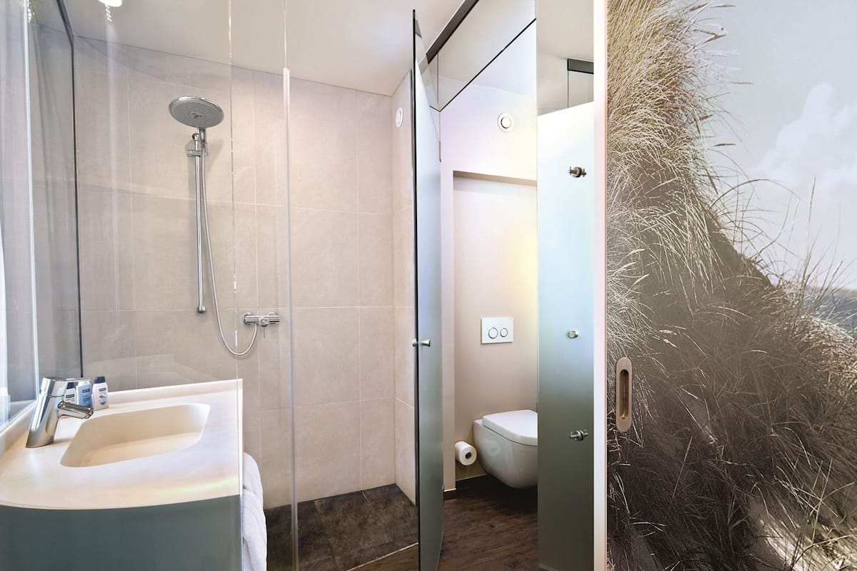 shower, rainfall showerhead, hair dryer, towels