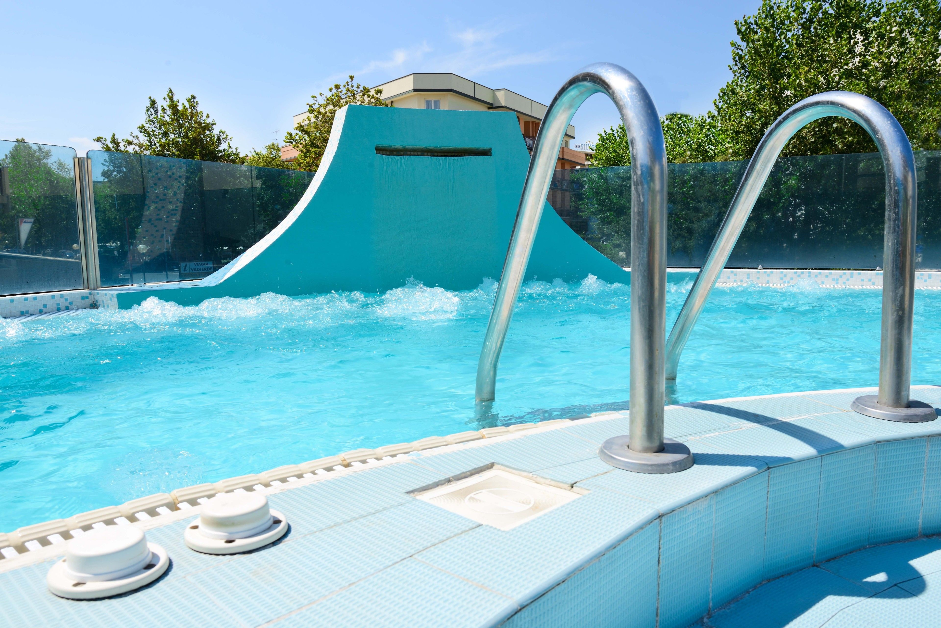 outdoor pool, open 7:00 am to 7:00 pm, pool loungers