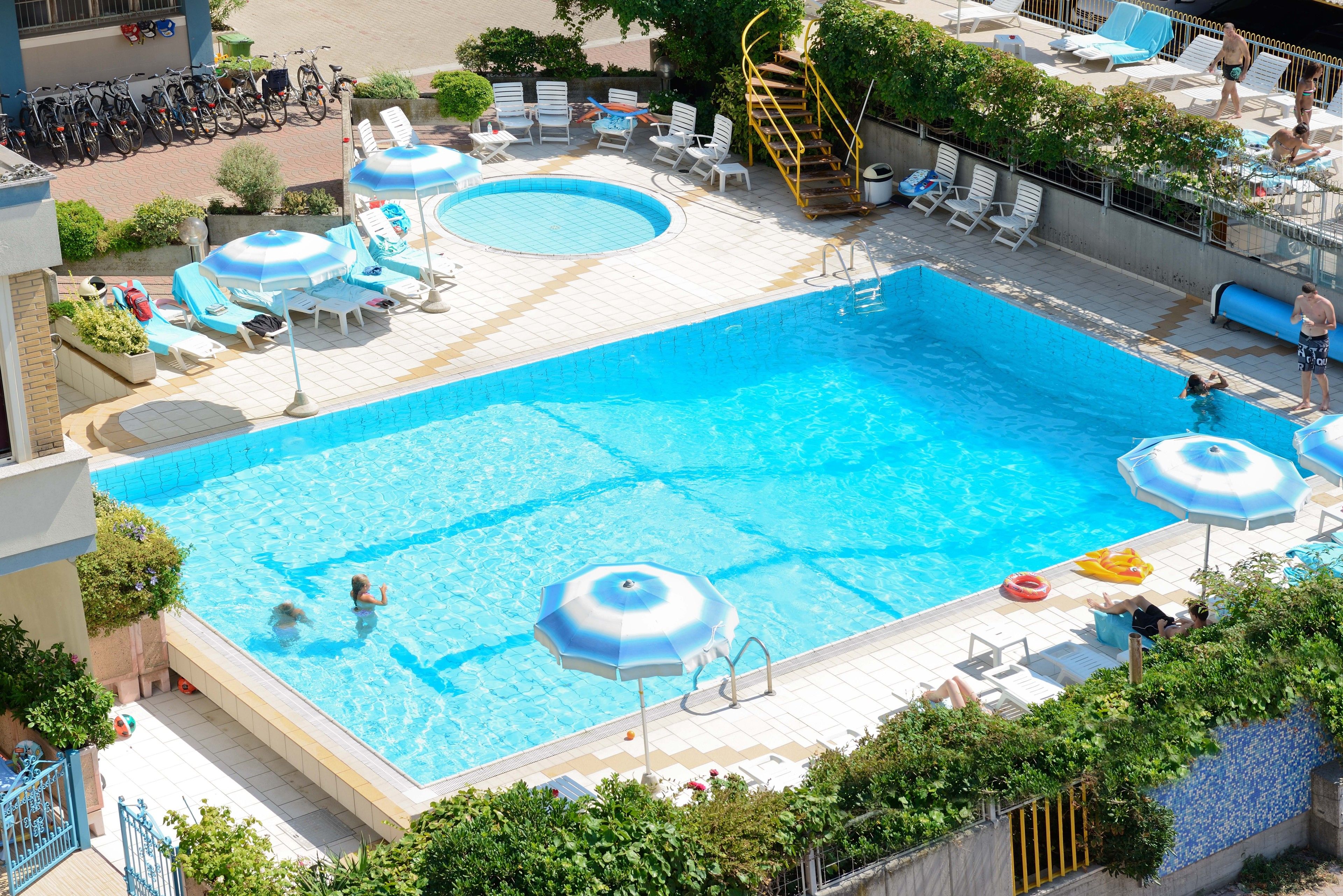 outdoor pool, open 7:00 am to 7:00 pm, pool loungers