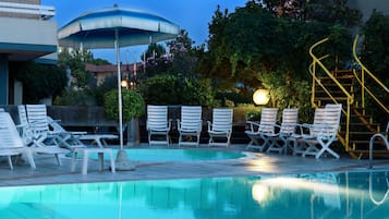 Outdoor pool, open 7:00 AM to 7:00 PM, pool loungers