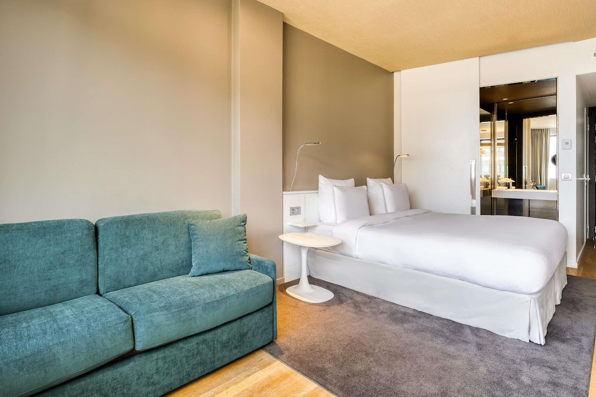 Family Room, 1 King Bed with Sofa bed, City View | Free minibar, in-room safe, desk, blackout curtains