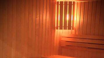 A sauna with wooden benches and a bench seat.