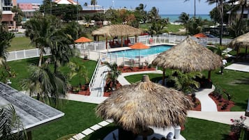 Outdoor pool, open 9:00 AM to 7:00 PM, pool umbrellas, pool loungers
