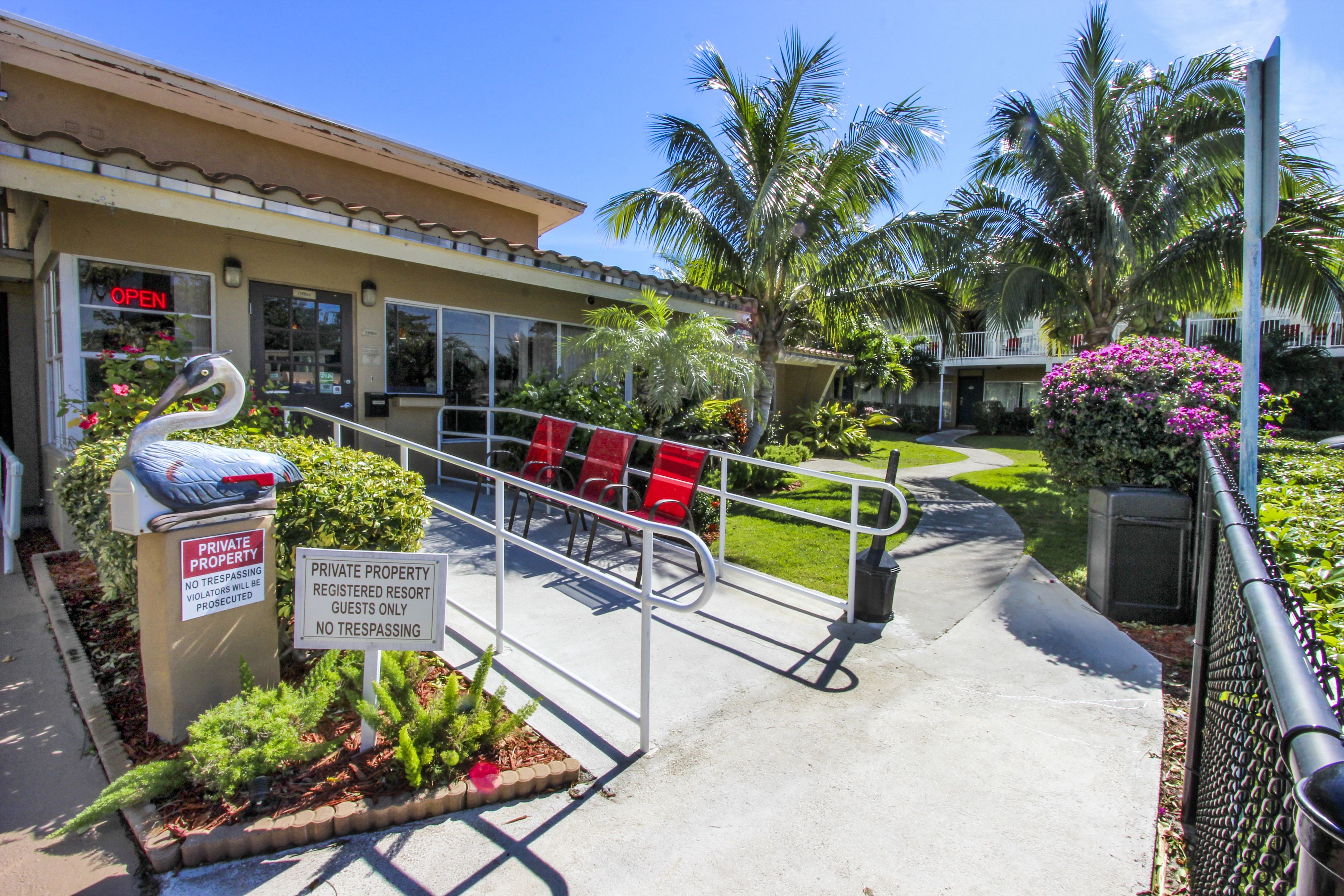 A private property with a sign indicating no trespassing and registered resort guests only.