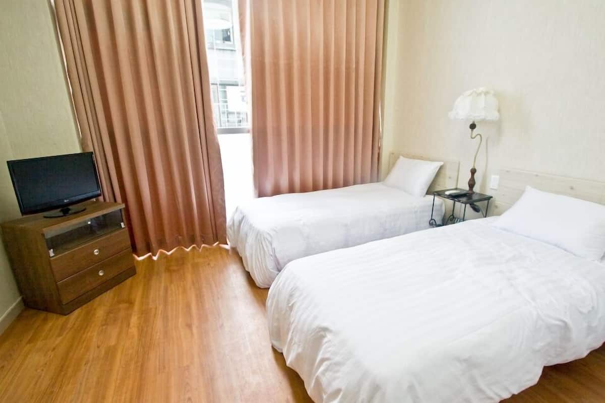 Standaard Twin kamer | Verduisterende gordijnen, een strijkplank/strijkijzer, extra bedden