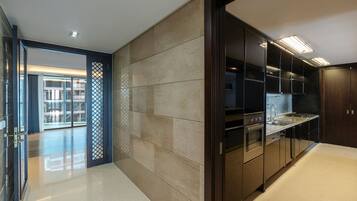 A modern kitchen with sleek cabinetry, a stainless steel range, and a dishwasher.