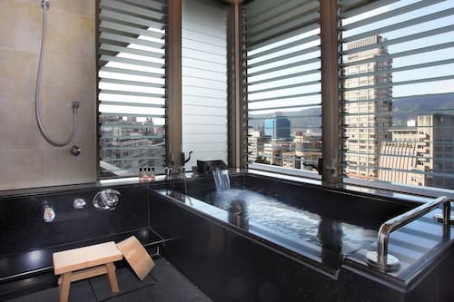 Deluxe Quadruple Room, Multiple Beds, Balcony, Tower | Bathroom | Separate tub and shower, spring water tub, free toiletries, hair dryer