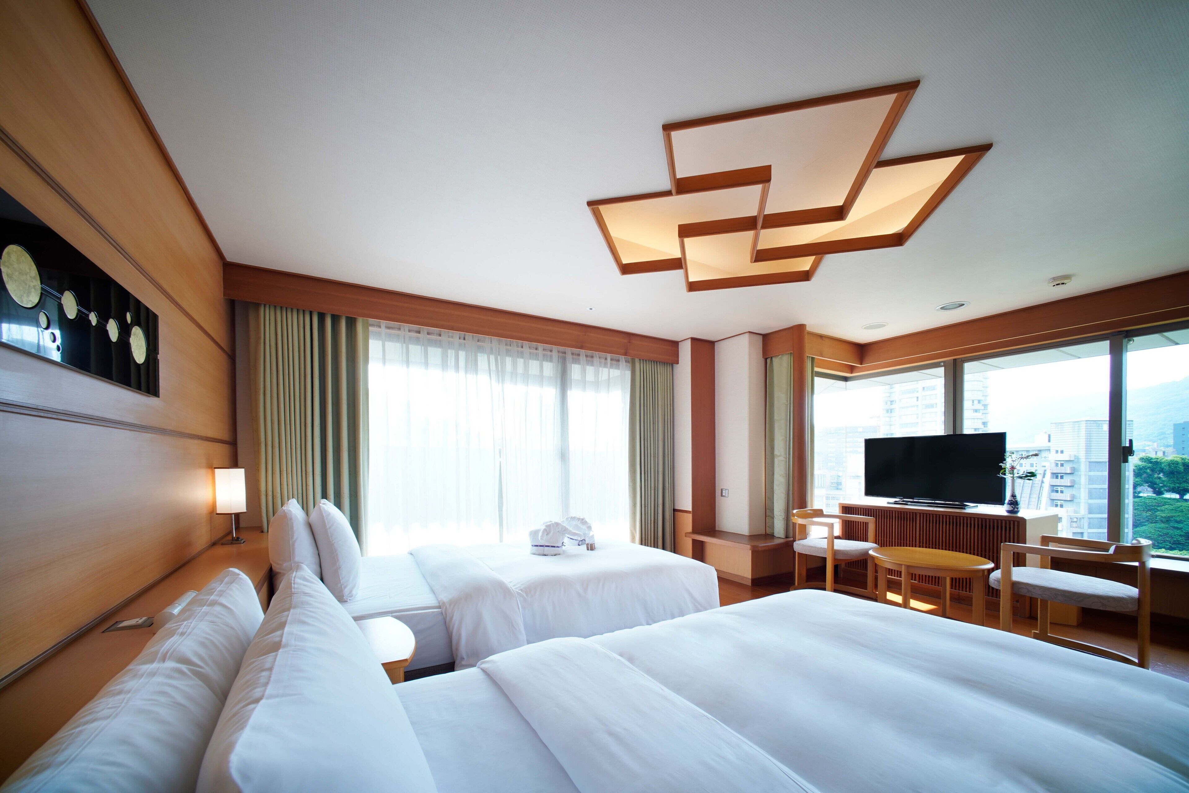 deluxe quadruple room, multiple beds, balcony, tower | 1 bedroom, premium bedding, down duvets, free minibar