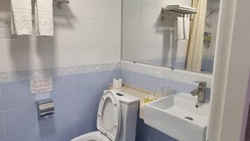 Apartment, 1 Bedroom | Bathroom | Combined shower/tub, deep soaking tub, free toiletries, hair dryer