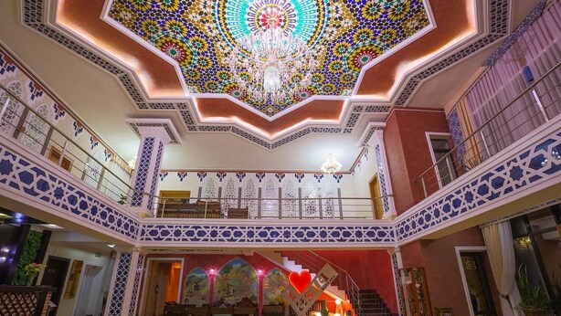 A grand lobby with a high ceiling, intricate ceiling design, and a staircase leading to an upper level. - Asia Bukhara Hotel (Bukhara)