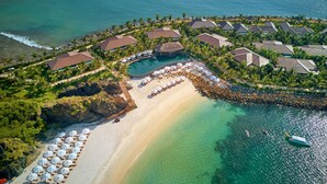 An aerial view of a resort with multiple buildings, a beach, and a pool. - Amiana Resort Nha Trang (Bac Nha Trang)