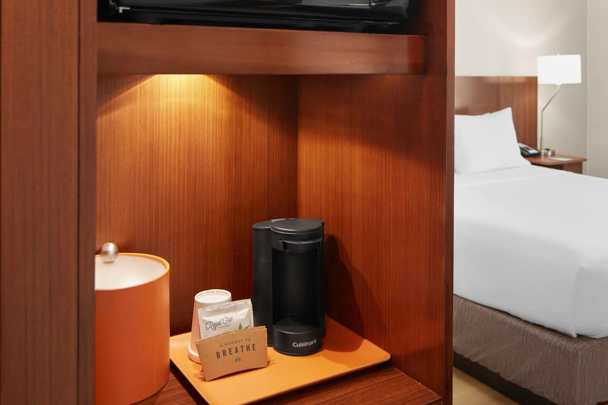 desk, laptop workspace, blackout curtains, iron/ironing board