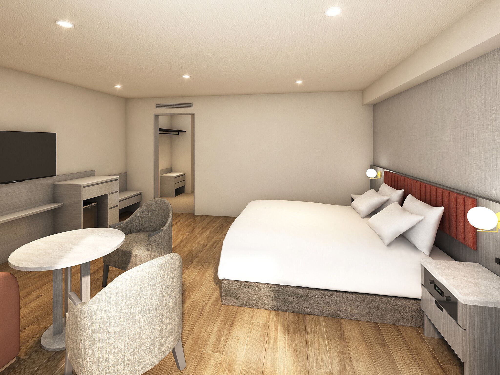 Une chambre d’hôtel moderne équipée d’un lit, de tables de chevet, d’une télévision, d’un bureau et d’une chaise.
