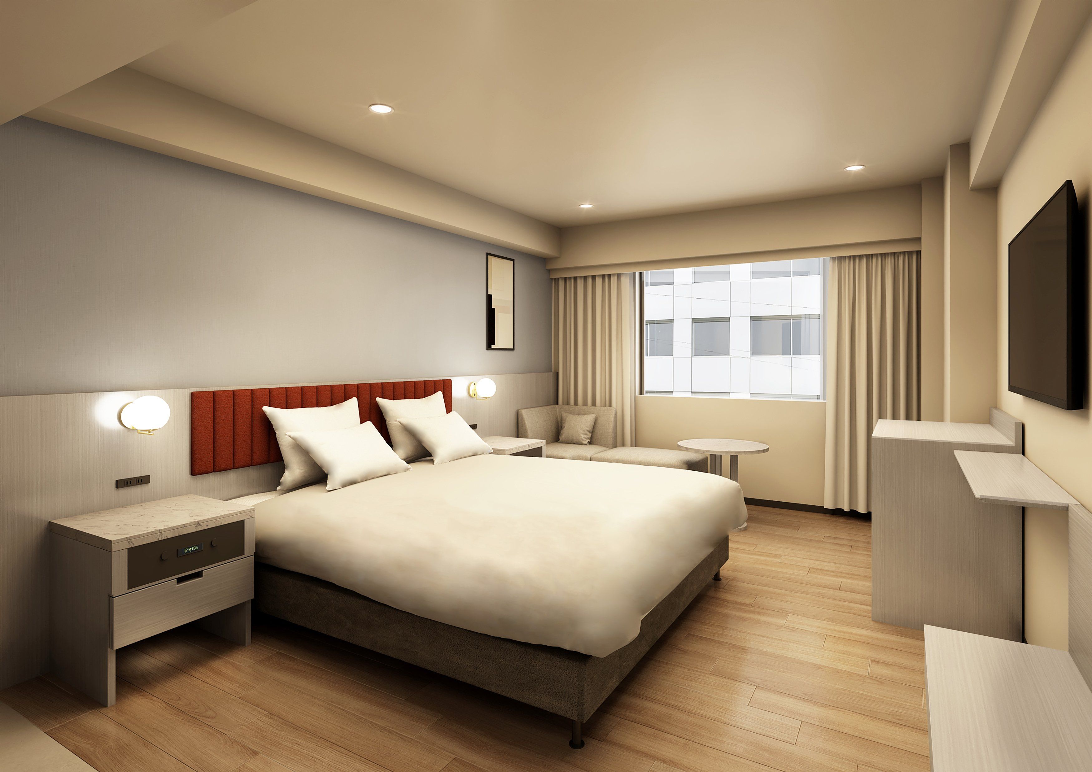 A modern hotel room with a large bed, bedside tables, a small round table, and a TV mounted on the wall.