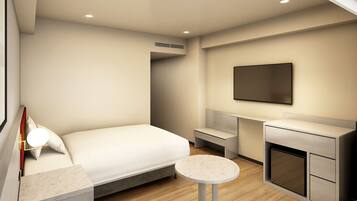 Een moderne hotelkamer met een bed, een klein rond tafeltje, een televisie en een kitchenette.