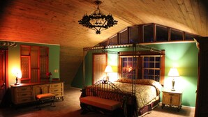 A bedroom with a four-poster bed, a bench, a dresser, and two bedside tables with lamps. - Millsap-baker Estate (Damascus)