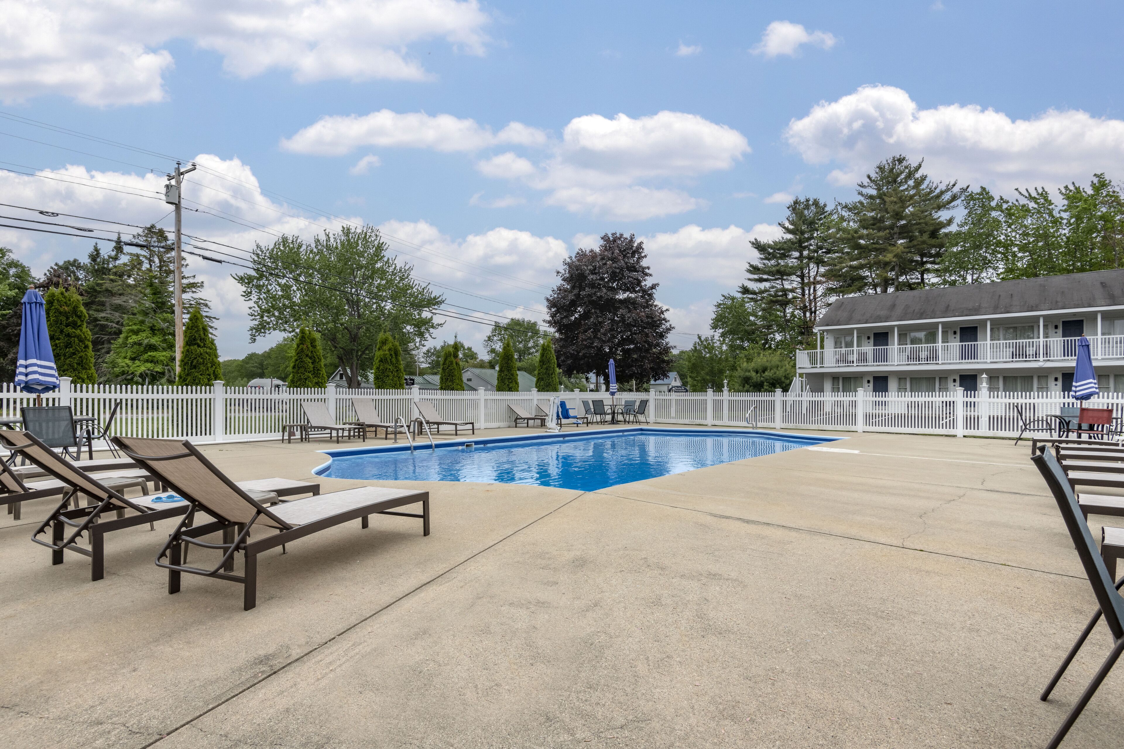 Seasonal outdoor pool, open 9:00 AM to 9:00 PM, pool umbrellas