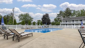 Seasonal outdoor pool, open 9:00 AM to 9:00 PM, pool umbrellas