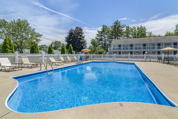Seasonal outdoor pool, open 9:00 AM to 9:00 PM, pool umbrellas